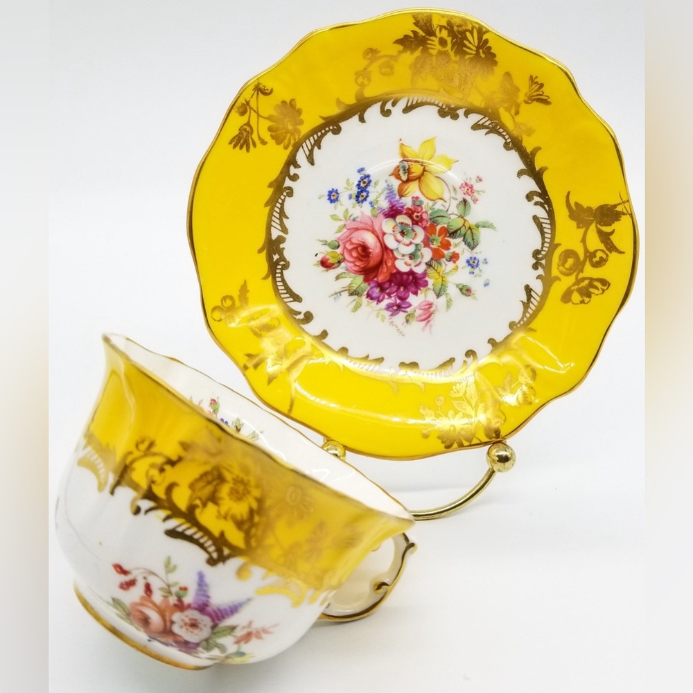 Hammersley bone China yellow teacup with gold trim and floral design